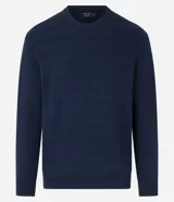 Suéter negro de punto con cuello redondo y mangas largas. Diseño con líneas horizontales en relieve.