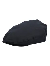 Boina estilo plana de color azul navy, confeccionada con canvas engrasado inglés impermeable y forro interior de algodón orgánico.