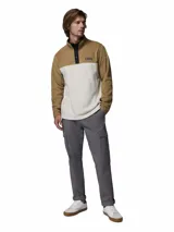 Buzo polar Columbia modelo Steens Mountain, de diseño color block en tonos beige y blanco. Presenta cuello alto con cierre de botones a presión, mangas largas y logo de la marca bordado en el pecho.