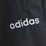 Pantalón deportivo adidas Alemania 1994 de color negro, con cintura elástica con cordón ajustable, bolsillos laterales con cierre y puños elásticos en los tobillos. Presenta detalles de la selección alemana y de la marca.