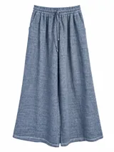 Pantalon ancho de lino color azul jean con cintura elastizada y cordón ajustable.