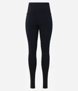 Pantalón legging negro de punto roma con cintura elástica y detalle lateral en cirre.