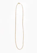 Cadena dorada finita de acero quirúrgico hipoalergénico.