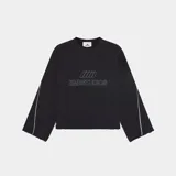 Buzo negro de corte oversize con cuello redondo, mangas largas con costuras laterales blancas y bordes desflecados.
