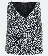 Blusa corta de poliéster con estampado de corazones, escote en V y sin mangas.