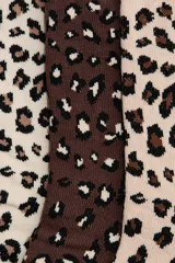 Pack de siete pares de medias de caña media con diferentes diseños: animal print en tonos beige y marrón, negro liso y blanco liso.