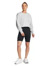 Short deportivo Under Armour de tiro alto, confeccionado en tejido de mezcla de algodón, poliéster y elastano. Presenta un diseño ajustado con logo de la marca estampado en la pierna derecha.