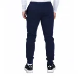 Pantalón de jogging Umbro confeccionado en felpa, con corte ajustado, puños elásticos en los tobillos y logo de la marca bordado en la pierna izquierda.