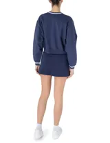 Buzo corto azul marino de algodón con cuello en V y logo de Prince bordado en blanco.