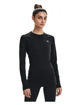 Remera térmica deportiva Under Armour modelo CG Authentics Crew, color negro, de manga larga con diseño raglán, cuello redondo y ajuste ceñido. Cuenta con el logo de la marca estampado en el pecho en color blanco.