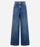 Pantalón de jean de corte wide leg, tiro alto, con bolsillos delanteros y traseros, trabillas para cinturón y cierre frontal con cremallera y botón.