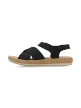 Sandalia de cuero nobuck color negro, con tiras cruzadas en el empeine y tira ajustable con velcro en el talón. Cuenta con suela plana efecto corcho y plantilla acolchada.