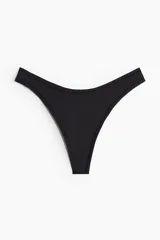 Colaless de microfibra negra, de tiro bajo con cintura en V y refuerzo interior.