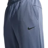 Pantalón deportivo Nike modelo Totality, color azul grisáceo, con cintura elástica ajustable mediante cordón y logo de la marca bordado en el lateral.