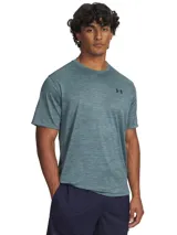 Remera deportiva de entrenamiento Under Armour, confeccionada en tejido de punto ultratranspirable y ligero con textura jaspeada. Presenta cuello redondo, mangas cortas y logo de la marca en el pecho.