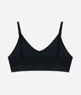Soutien tipo top de diseño seamless, confeccionado en poliamida texturizada de color negro. Presenta base ancha, copas removibles y breteles finos regulables.