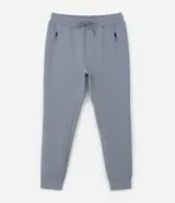 Pantalón deportivo de hombre color beige, liso, con ajuste elástico en la cintura y bolsillos laterales.