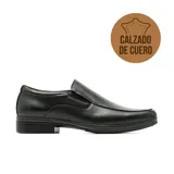 Zapato de vestir Hanker modelo Aratz, color negro, confeccionado en cuero, de diseño clásico con elásticos laterales y suela con pequeño tacón.