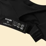 Sujetador deportivo de sujeción fuerte color negro, con diseño de escote redondeado y tirantes dobles ajustables en la espalda.