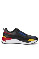 Championes deportivos Puma X-Ray en combinación de azul, gris y negro, con detalles en amarillo flúor y suela blanca y azul.
