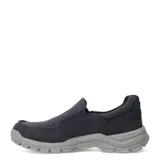 Zapatos tipo slip-on de la marca Caterpillar, confeccionados en lona de color azul marino. Presentan un diseño de estilo casual con costuras reforzadas en la puntera, elásticos laterales para un calce fácil y una suela de goma robusta en color gris con el logo de la marca en el lateral.