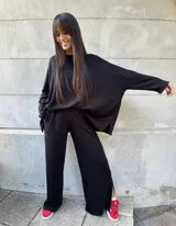 Buzo negro oversize de lanilla con lurex.