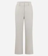 Pantalón de sastrería marca Cortelle, de corte recto y color beige. Presenta pliegues delanteros, cintura con trabillas, cierre frontal y bolsillos traseros embutidos.