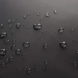 Mochila negra de poliéster y cuero, con asas reforzadas, compartimento para laptop de hasta 17 pulgadas, bolsillo trasero oculto y cinturón para valija. Marca Baleine, modelo Bedford.