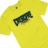 Remera negra de manga corta con estampado frontal del logo de Creature en verde y amarillo sobre una telaraña.