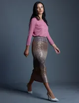 Cardigan tejido en hilado fino, marca Cable & Gauge, color negro. Abertura central con botones con brillo y mangas 3/4.