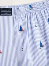 Bóxer negro de algodón liviano, con cintura elastizada y estampado integral de pequeños tractores verdes.