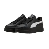 Championes Puma modelo Karmen Classic con plataforma, de color blanco con detalle de franja lateral en negro y logo plateado.