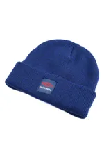 Gorro tipo beanie de tejido de punto color azul, con vuelta y parche frontal con el logo de Umbro y la inscripción Nacional.
