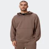 Canguro negro de tejido ComfortKnit con textura tipo waffle, capucha estructurada, media cremallera frontal y bolsillo tipo canguro con compartimento integrado para el móvil.