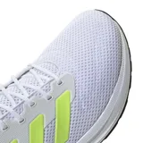 Championes de running Adidas Response Runner, color blanco con detalles en amarillo neón. Presentan una estructura de malla transpirable, cierre con cordones y mediasuela de EVA para mayor amortiguación.