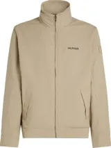 Campera Tommy Hilfiger color beige con cuello alto y cierre de cremallera. Tiene dos bolsillos laterales, detalles distintivos de la marca y logo engomado bordado en la manga.