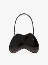 Bolso de hombro Diesel modelo Double-D, con diseño estructurado y ergonómico en forma de arco. Presenta un acabado brillante tipo charol en color negro con degradado hacia tonos más claros en los extremos, asa fija y detalle de logo metálico en el frente.