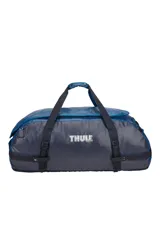 Bolso de viaje tipo duffel marca Thule, modelo Chasm de 130 litros, en color azul. Cuenta con gran apertura superior, correas convertibles para usar como mochila y diseño resistente.