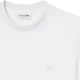 Remera Lacoste de manga corta y cuello redondo, color negro, con el clásico logo de cocodrilo bordado en el pecho.