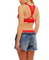 Bralette negro de malla transparente con ribete de encaje y espalda cruzada.