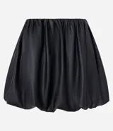 Minifalda balonê de poliuretano (PU) color negro, con cintura alta lisa y forro de poliéster.