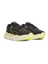 Championes Under Armour HB Runner 2, de color negro con detalles en amarillo fluor y suela chunky esculpida en tono claro con acentos amarillos.