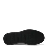 Championes urbanos Puma modelo Court Lally Skye, de diseño monocromático negro con plataforma elevada y cierre de cordones.