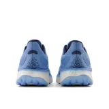 Championes de running New Balance Fresh Foam X 1080v12, color celeste con detalles en blanco.
