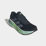 Championes de running Adidas Adistar 4, color azul oscuro con tres franjas grises en el lateral. La mediasuela es gruesa y presenta un degradado de color blanco a verde lima fluorescente, con la inscripción "REPETITOR".