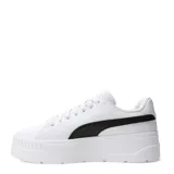 Championes de plataforma Puma modelo Karmen Classic, de color blanco con la franja lateral característica en negro y detalles dorados de la marca. Poseen suela chunky de goma y capellada sintética.