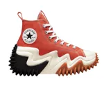 Championes Converse de caña alta con plataforma ondulada de diseño vanguardista. Presentan capellada de lona en color naranja, cordones blancos y suela de goma con relieve dentado en color negro y marrón.