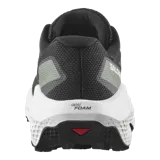 Championes de trail running Salomon Ultra Flow 2, de color negro con suela blanca y detalles en gris. Cuenta con upper de malla transpirable, entresuela amortiguada y suela con tacos para mayor tracción en terrenos difíciles.