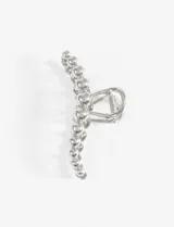 Broche plateado para el pelo con forma de pinza y detalle de bolas.