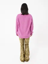 Pantalón flare de lentejuelas doradas elastizadas con base de velvet.